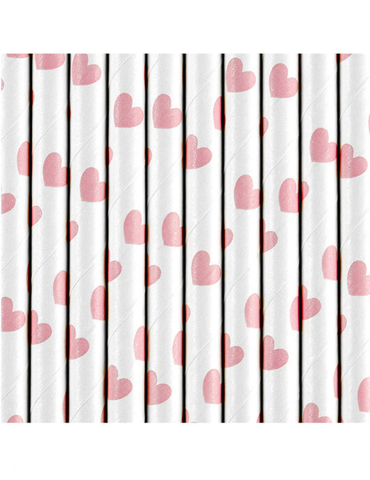Gros plan sur les motifs de cœurs roses des pailles en carton Saint-Valentin