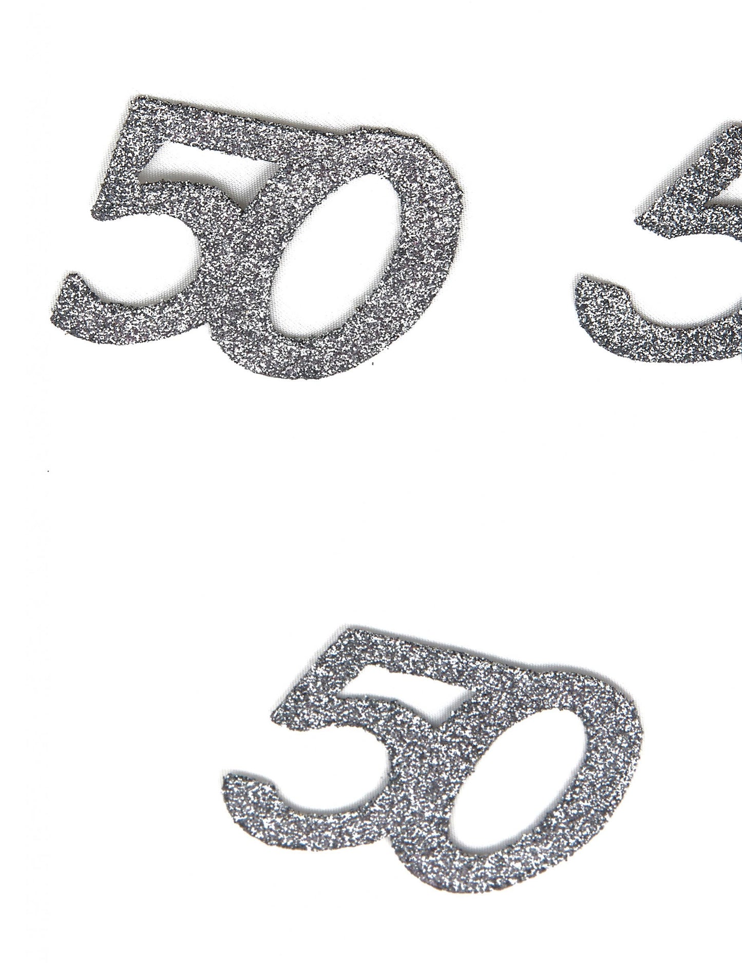 Detailný záber na trblietavú textúru konfiet 50 rokov na oslavu narodenín