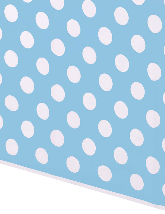 Gros plan sur le motif à pois de la nappe à pois pour fête bleue et blanche en plastique