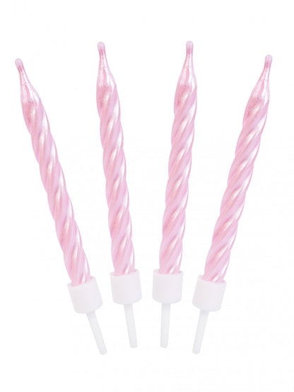 Gros plan des bougies d'anniversaire spirales roses nacrées