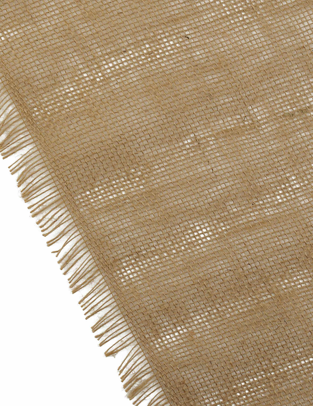 Détail des franges et du tissage du chemin de table bohème chic