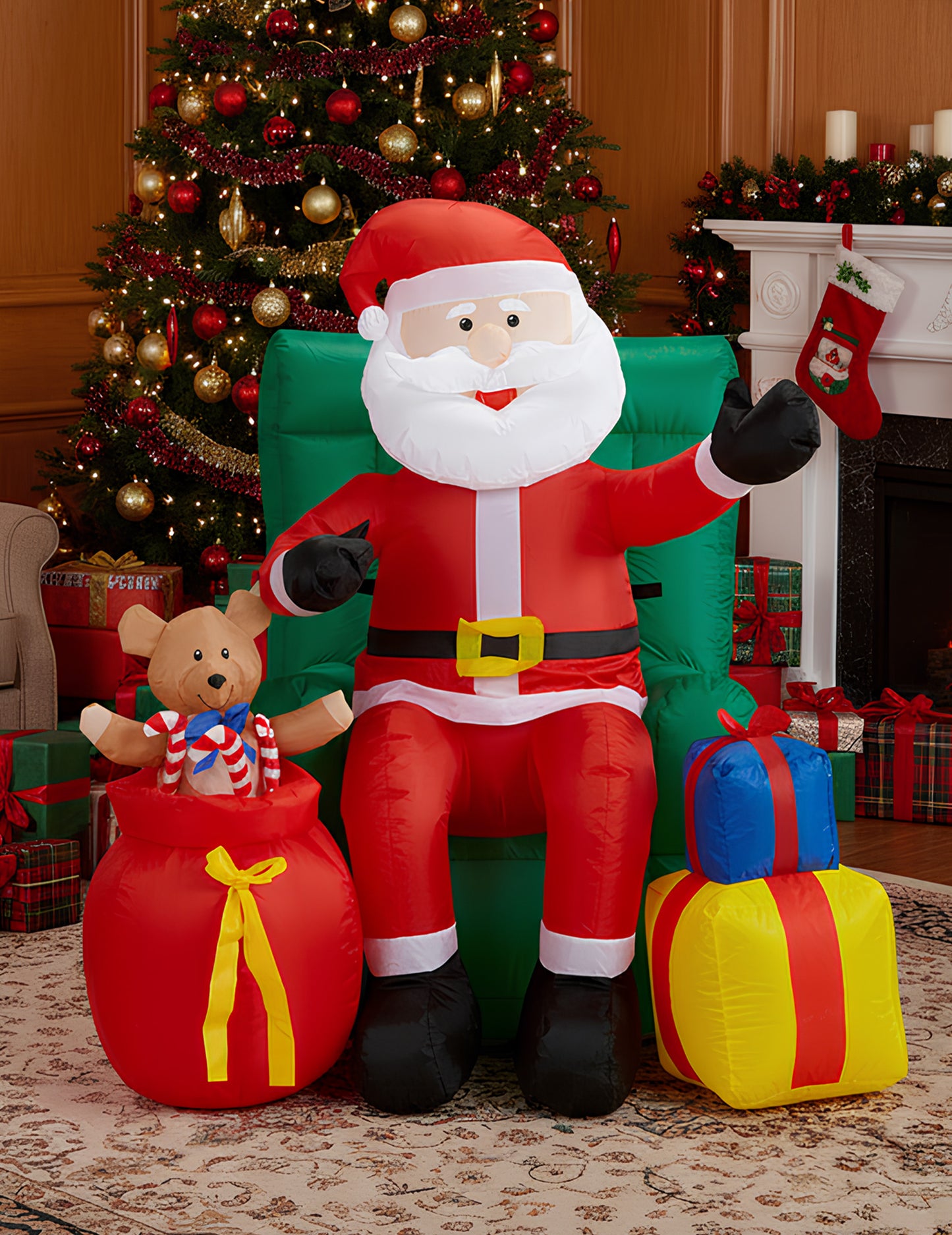 Nafukovacia pohyblivá dekorácia sediaci Santa Claus s darčekmi 122 cm 