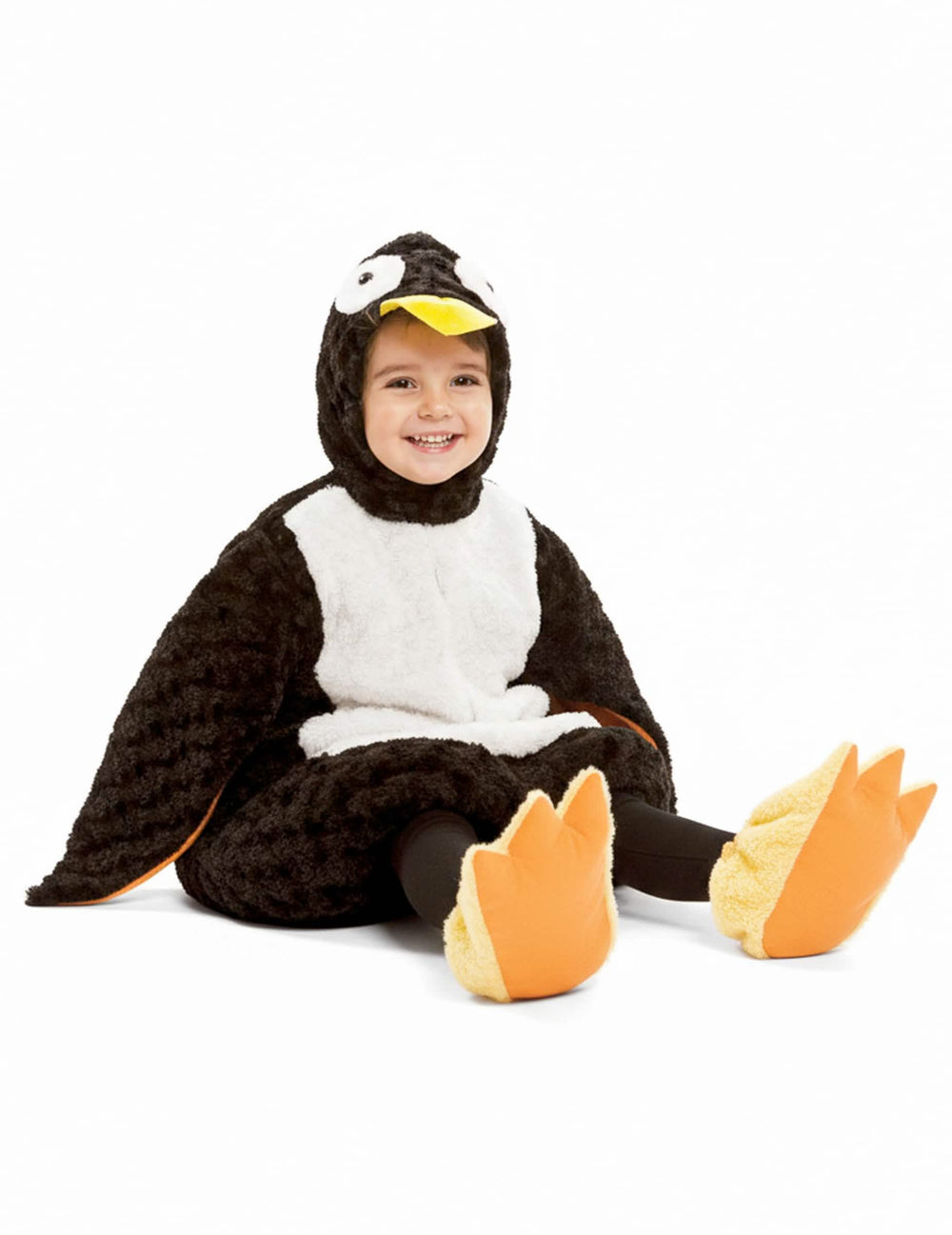 Vue de face enfant assis du déguisement de pingouin peluche