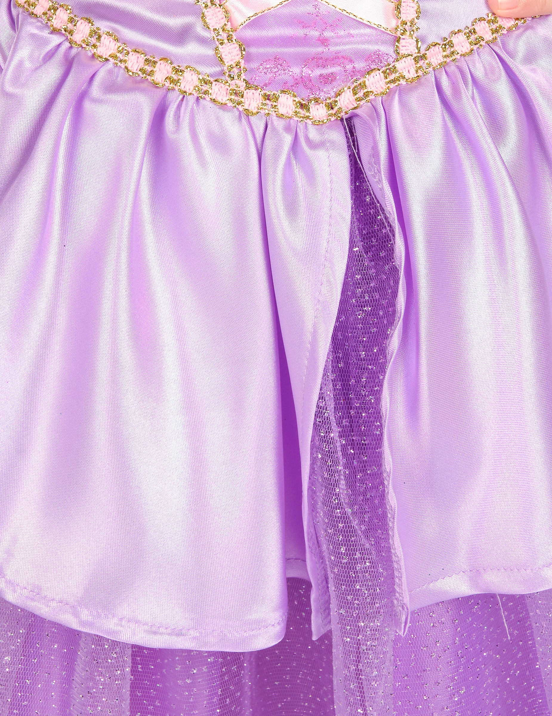 Détail de la jupe satinée et du jupon pailleté du déguisement deluxe Raiponce™ pour fille