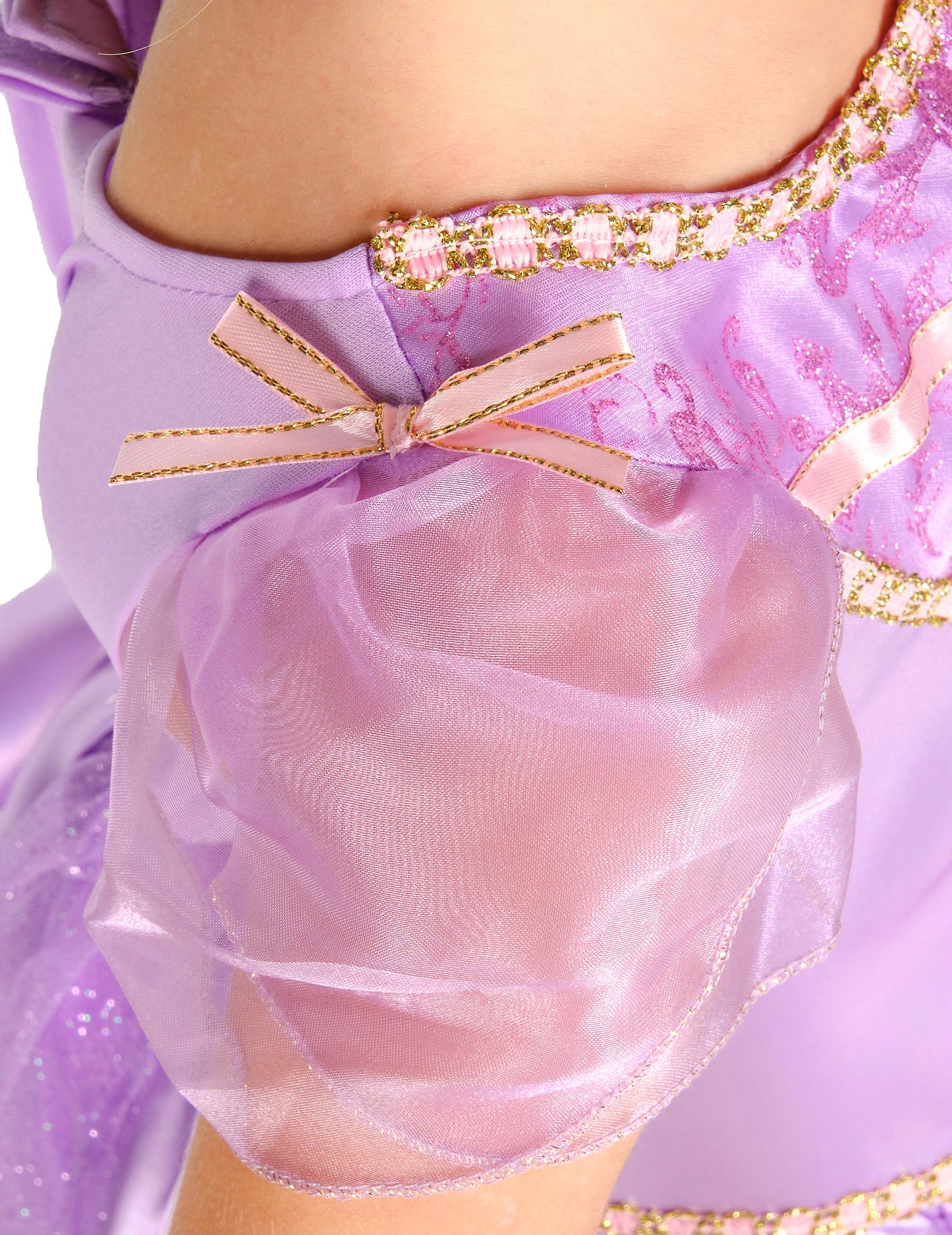 Détail de la manche bouffante et du nœud rose du déguisement deluxe Raiponce™ pour fille