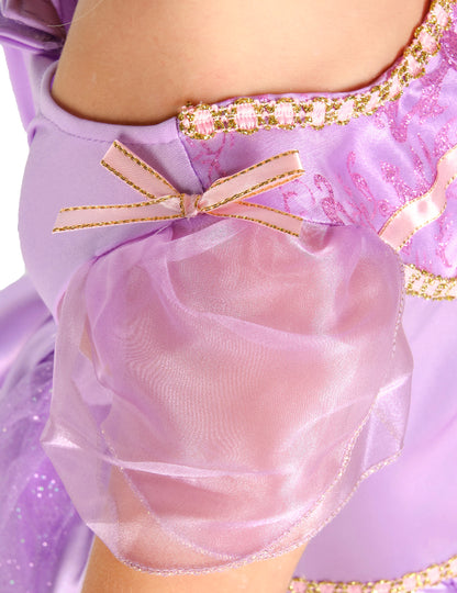 Détail de la manche bouffante et du nœud rose du déguisement deluxe Raiponce™ pour fille