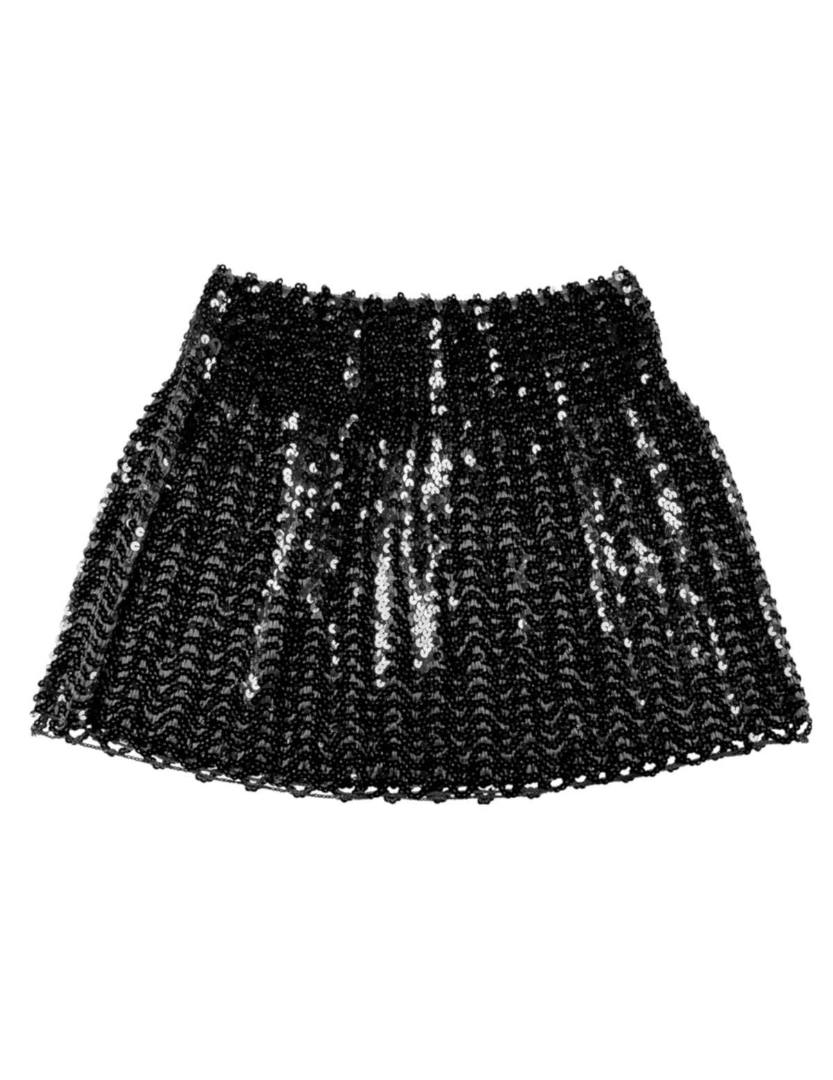 Umiestnenie do sviatočnej atmosféry na pozadí čiernej dámskej sukne s flitrami