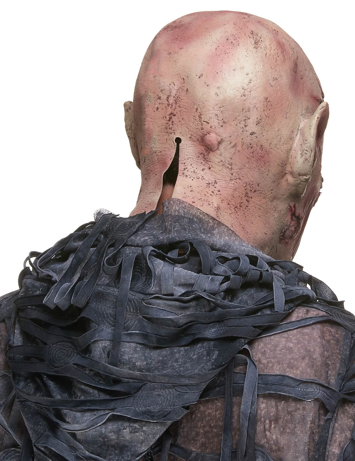 Pohľad zozadu na latexovú masku kričiaceho démona