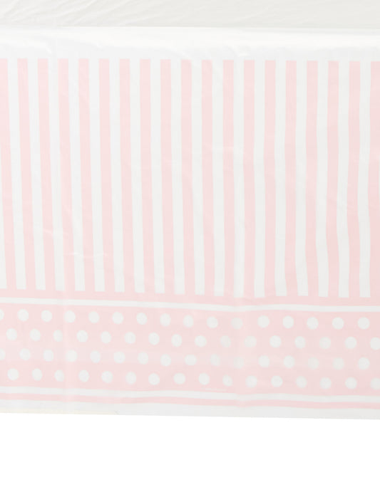 Détail des motifs de la nappe en plastique rayé et à pois pour fête rose et blanc