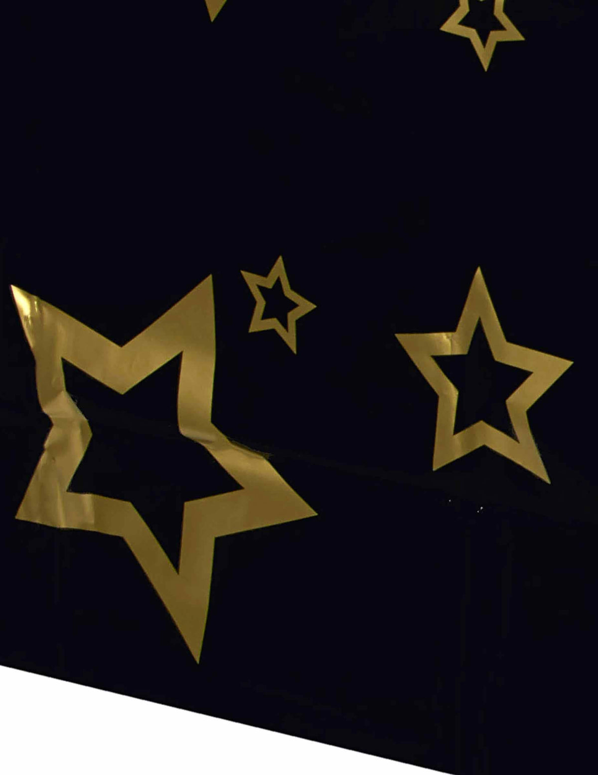 Detailný záber na motívy zlatých hviezd plastového obrusu VIP