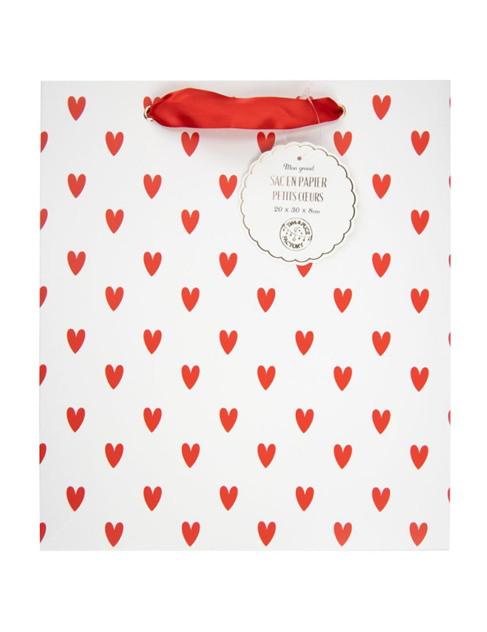 Gros plan sur l'étiquette et le motif du sac en papier petits cœurs